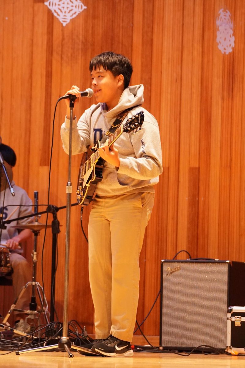 Junior Yujun Piao sings his heart out in a  ballad from the popular anime "Case Closed." Following months of dedication, his fingers move instinctually to the music.