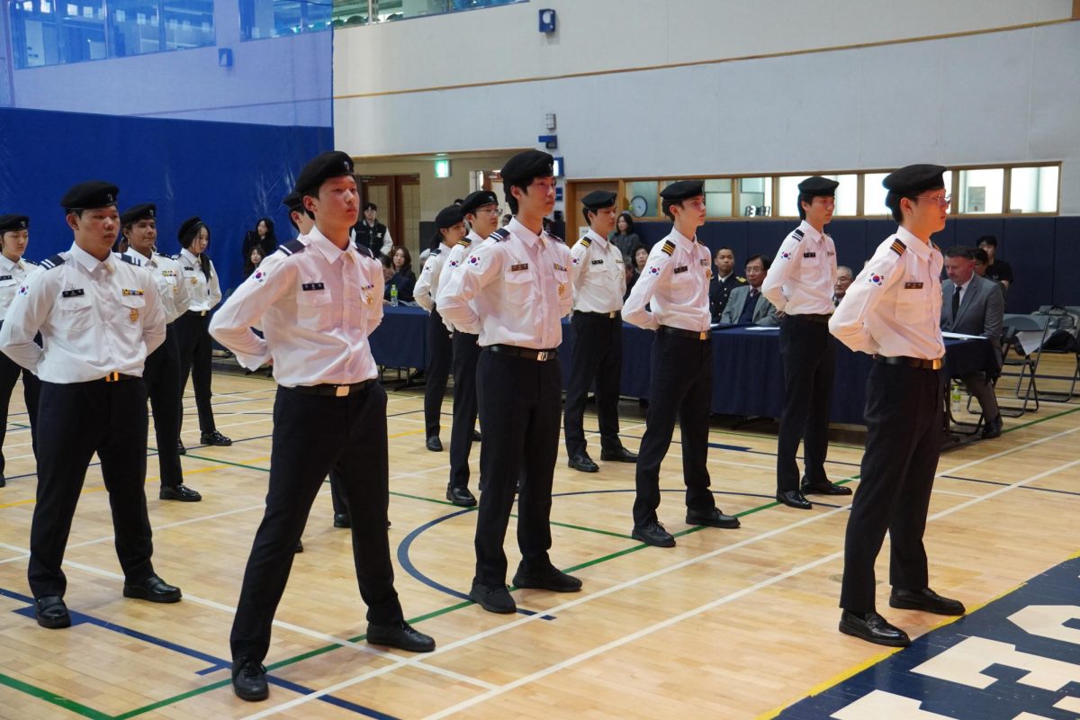 Standing tall, the cadets prepare for their salute. Their gesture symbolizes their shared commitment towards leadership and service.