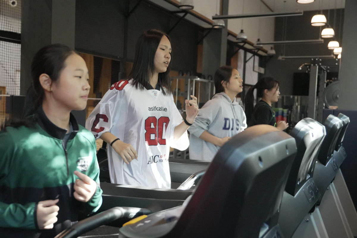 Middle school girls take on another round of sprint intervals on the running machines. Through the quiet workouts of Tuesday afternoons, the girls learn and train, an opportunity that can not be gained in weekly football practices.