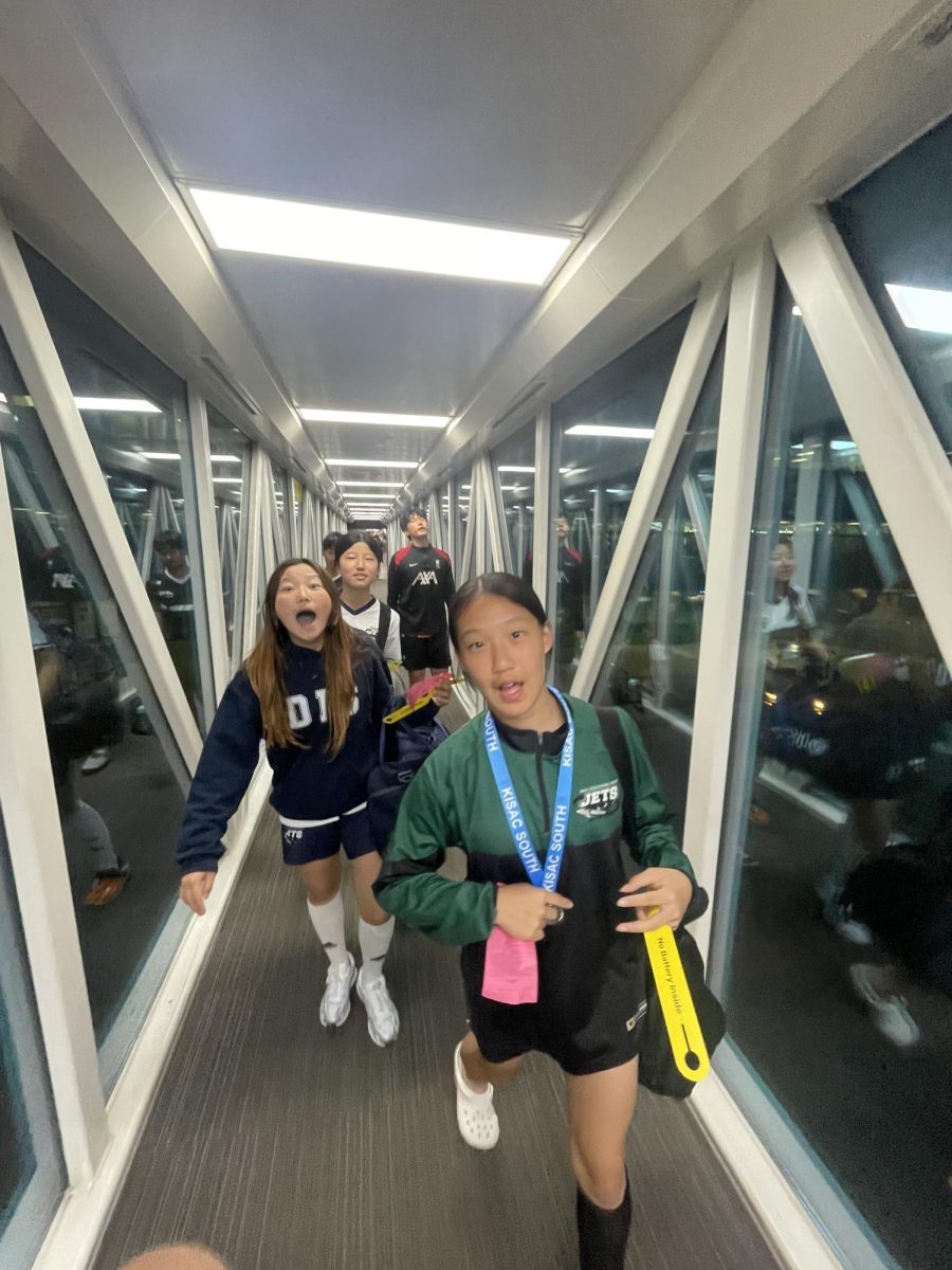 The girls pause for a quick photo during their trip to Jeju, showing excitement and anticipation ahead of competition. Energized and ready, the team sets out to make new memories and compete for medals. 