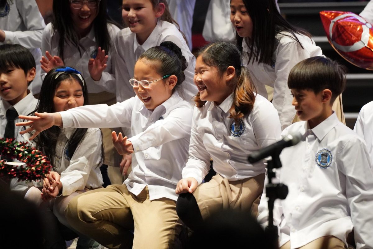 A cohort of fourth grade students gather around the stage after the show’s finale, still energized from the event. The enthusiasm remains as an unforgettable childhood memory for all. 