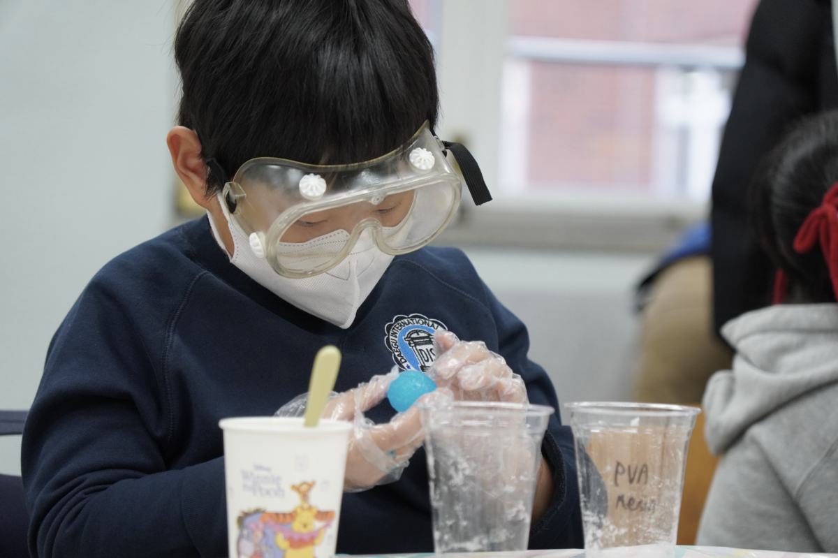 Third grader Jeff Lee meticulously molds the bouncy ball with his hands. By gently rolling and adjusting the material, he crafts the mixture into a smooth, circular figure.