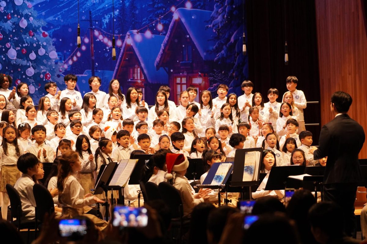 Elementary students chant as a choir under Mr. Park’s direction. Their voices blend in harmony and fill the space with confidence and joy.