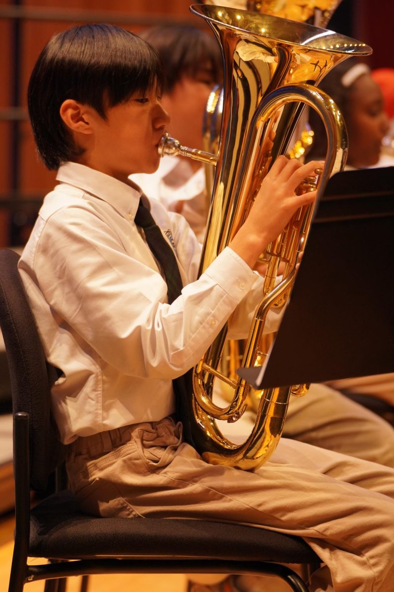 Weejee Kung in fifth grade keeps sharp attention on the music as he plays his euphonium. His steady approach reflects the dedication built throughout the semester.