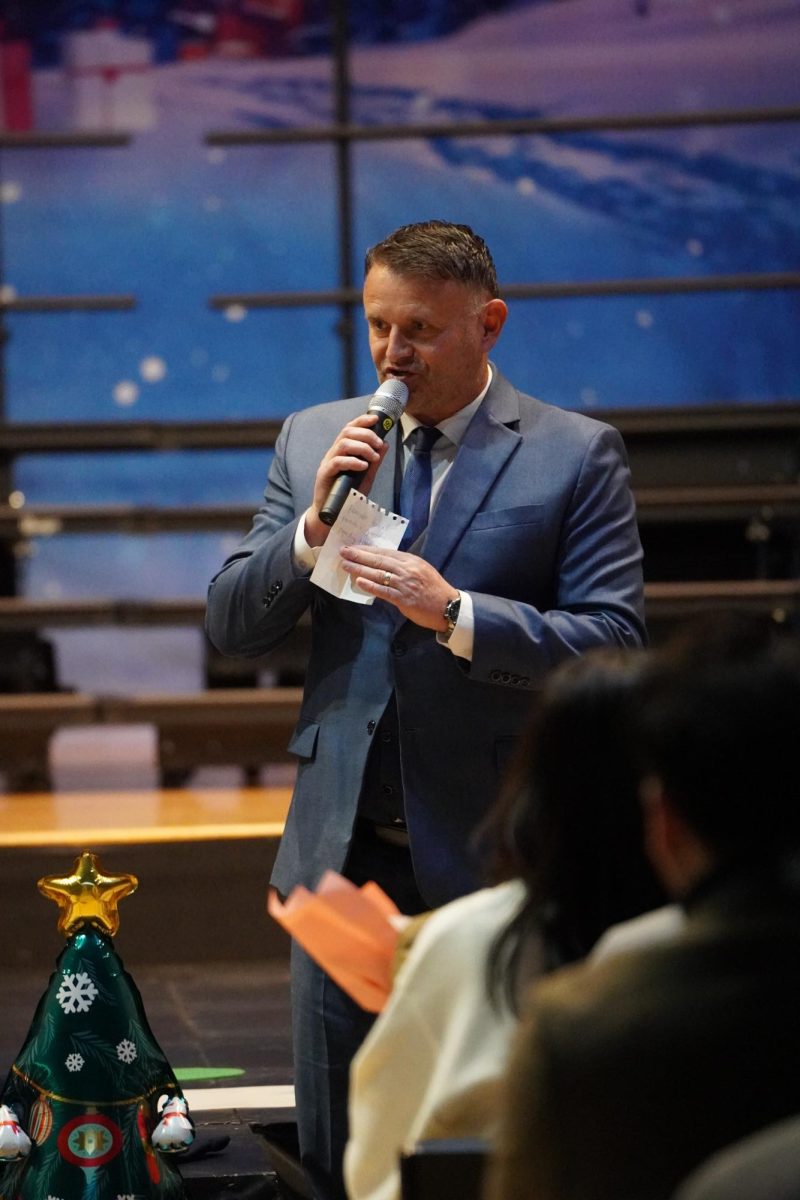 Head of School Mr. Jolly addresses the audience with welcoming remarks, encouraging and commending students that dedicated their time to prepare for the concert. 