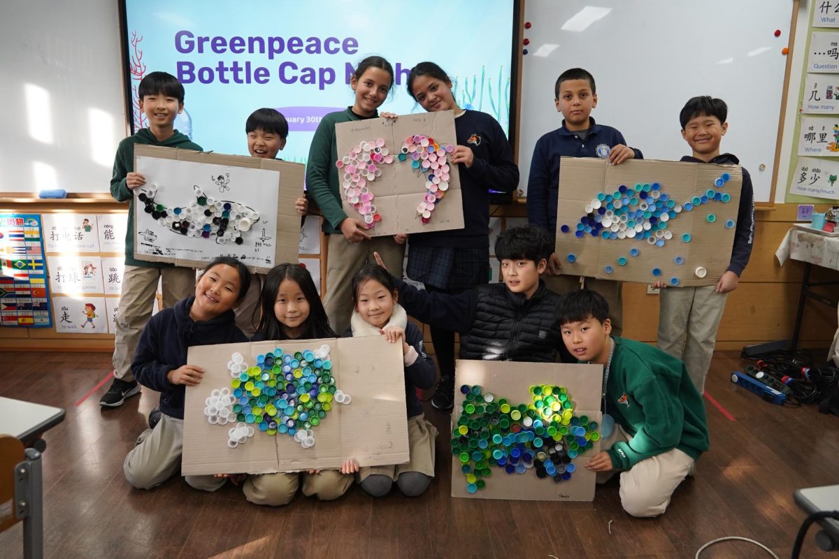 The participants gather and proudly present their completed bottle-cap artwork, holding up colorful creations made from recycled materials. The collaborative highlight creativity, teamwork and environmental awareness as participants transform everyday waste into meaningful art.
