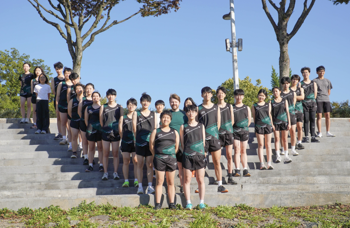 After the race, the DIS cross country team gathers as one, celebrating a season built on perseverance, teamwork, and countless miles. Laughter and pride mark the finish of a successful year shared together. 