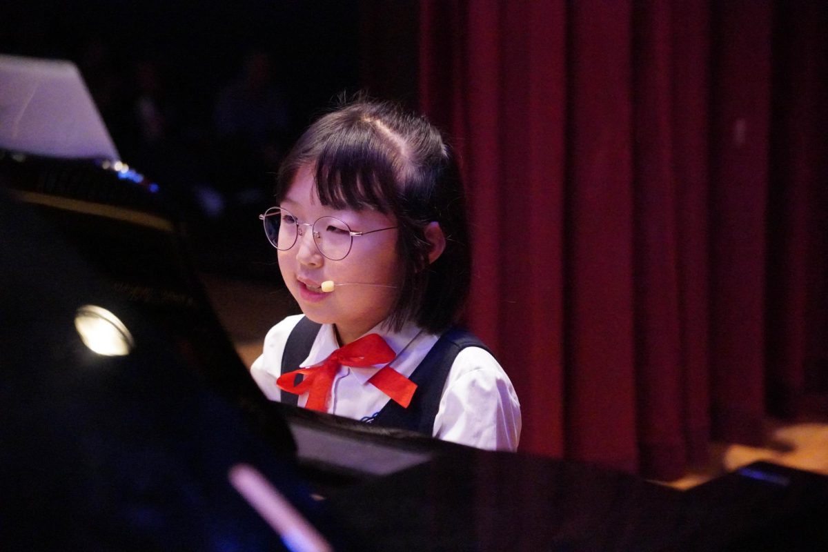 Second grader Arin Son blends her piano techniques and singing. Her controlled phrasing and musical balance creates a cohesive and engaging presence.