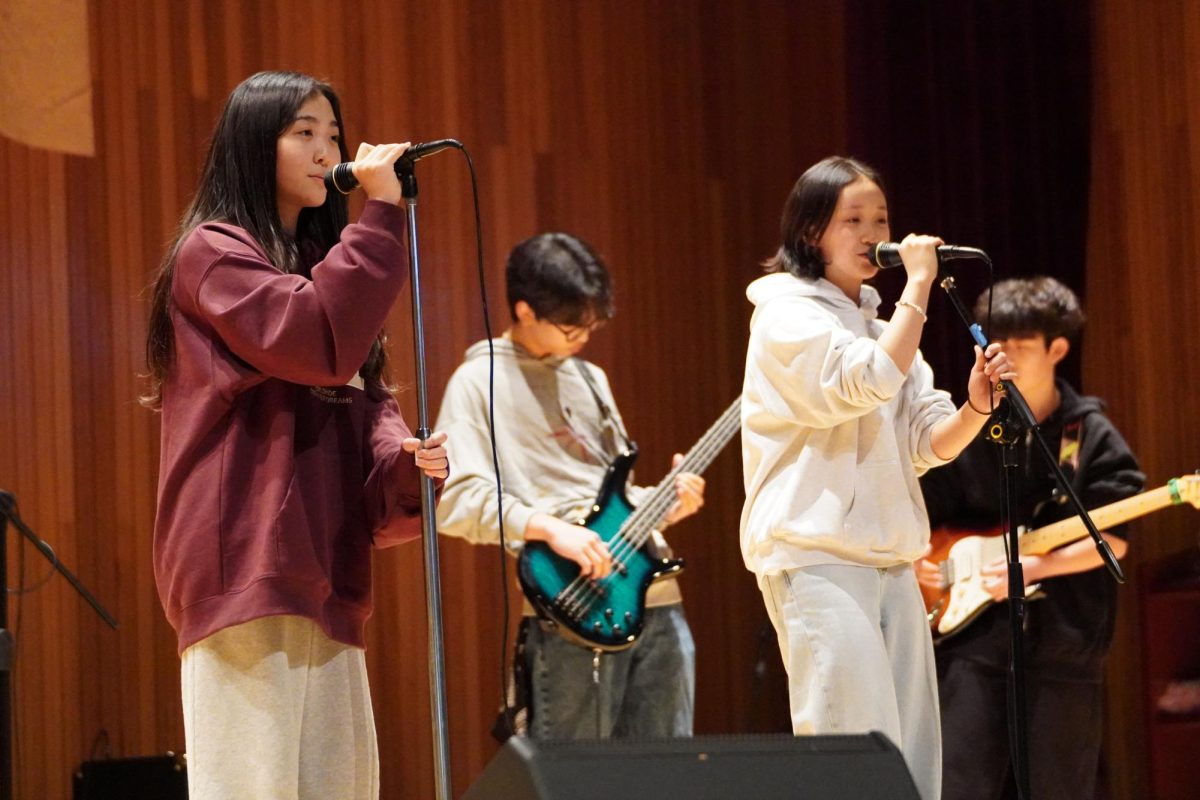 With steady harmony and heartfelt expression, seventh grader Molly Doh and eighth grader Olivia Cho perform a duet of a song from “Haikyuu!!”. Volleyball fans in the audience erupt in cheers and nostalgia. 