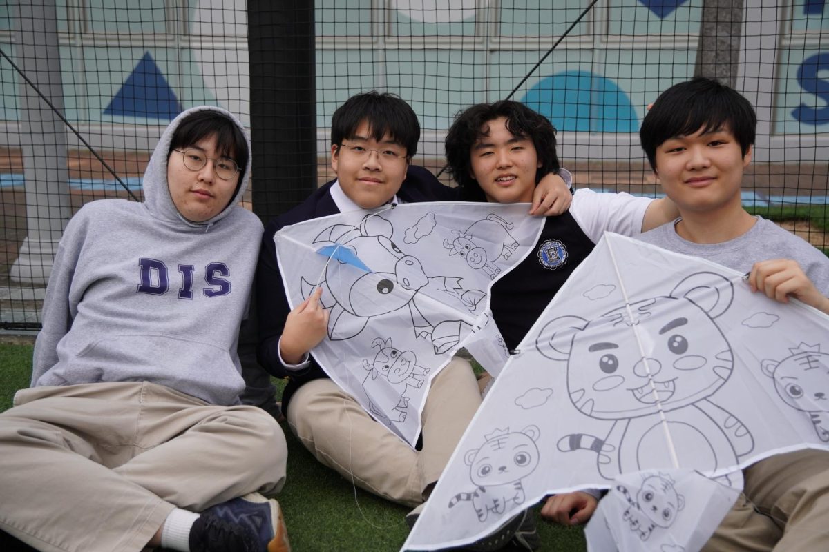 The high school boys proudly display their kites. Each of them picked out a design of their favorite Chinese zodiac animal. 