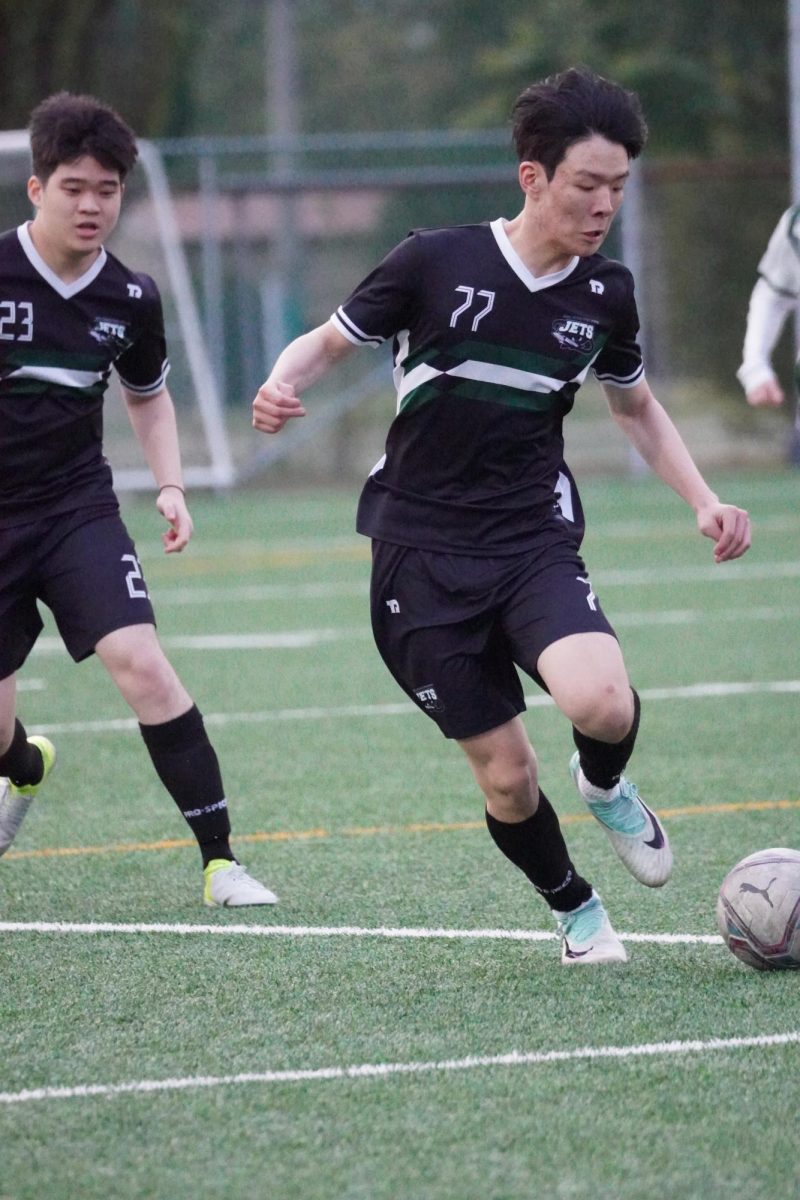 Right midfielder Jayden Lee (77) surges forward the wing, using the pent up energy to push the team into play. With crisp control and momentum, he sparks an attacking build-up as he presses the team higher for the winning goal. 