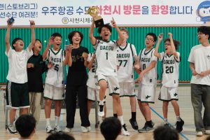 The junior varsity team erupts in celebration as they raise the championship trophy after a hard-fought tournament victory. Surrounded by cheering teammates, the Jets capture the excitement and pride of the team’s accomplishments.