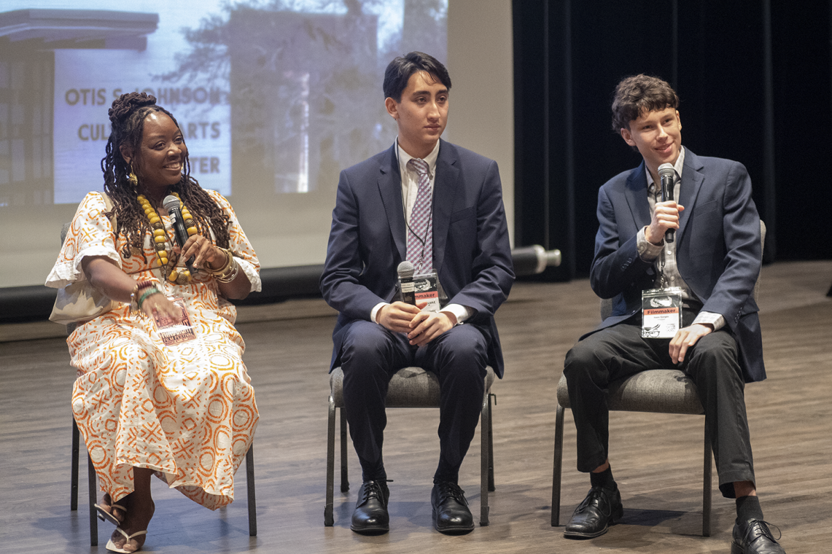 Junior Haydn Mangione joins fellow filmmakers Olubayo Jackson and Issac Gorge on stage during a Q&A session. As audience members and filmmakers engage in conversation, Mangione reflects on bringing the story of Korean language resistance to an international audience. Photo courtesy of Haydn Mangione. 