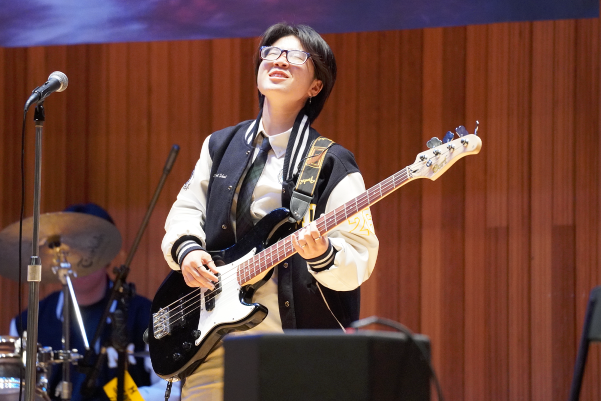 Senior Minori Kojima embraces her final performance as the bassist of “ASAP.” While strumming her instrument, she nervously anticipates her duet with vocalist Christine Mason. 